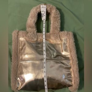 No Boundaries Gold Tote outlined in faux fur